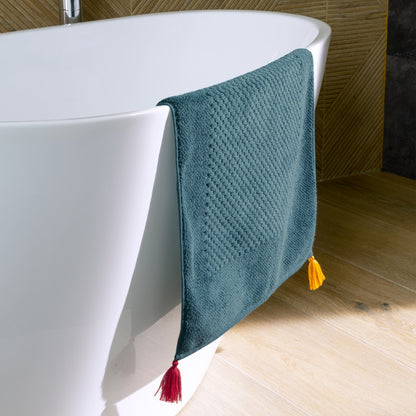 Eclats cotton bath mat in petrol blue