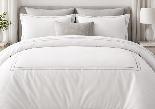 Hotel bed set with elegant double bourdon trim